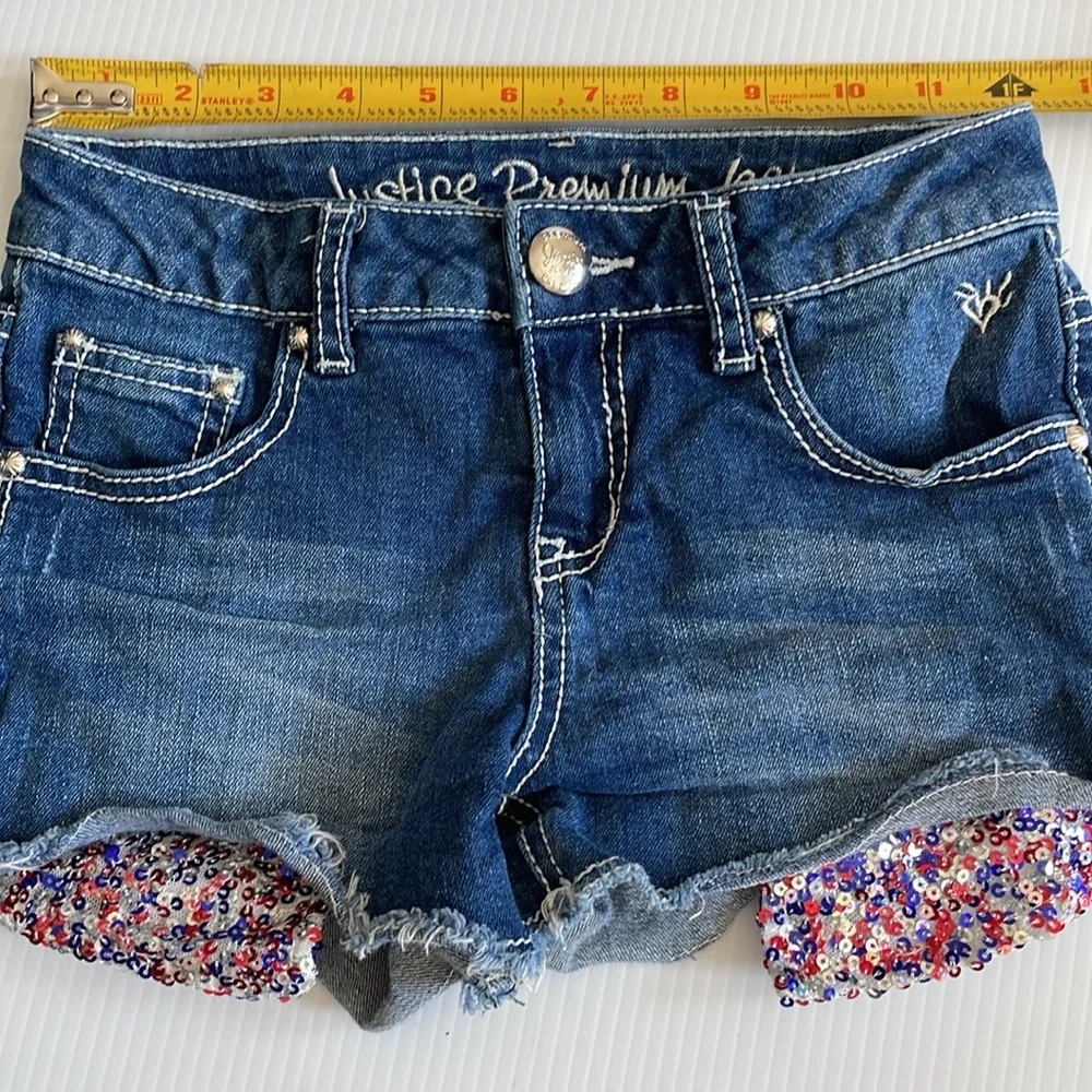 Justice denim jean shorts with red, blue & silver sequins. Girls size 10